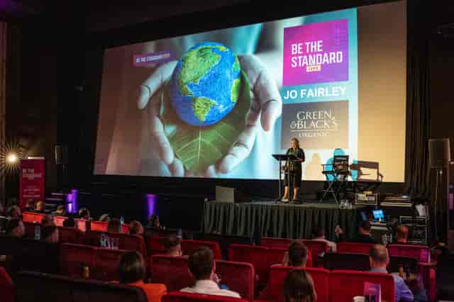 Everyman Leeds event with speaker, engaging audience, and "Be the Standard" theme.