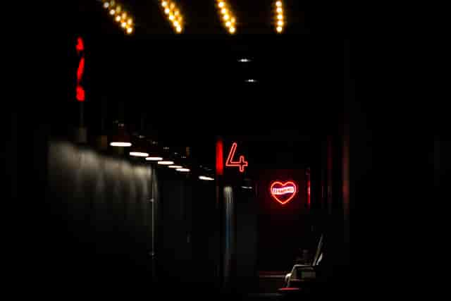 Cinema screens and neon lights in Everyman Leeds for creative events and gatherings.