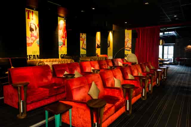 Stylish Screen 5 1/2 in Everyman Leeds with red seating for engagement events and networking.