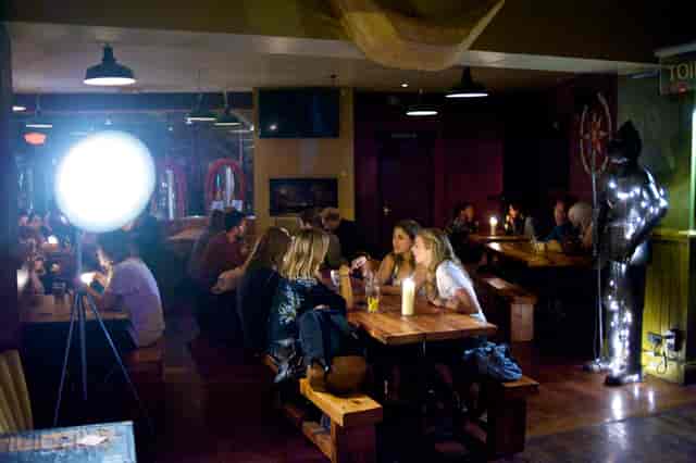 Cozy microbrewery venue with warm lighting, perfect for casual networking events.