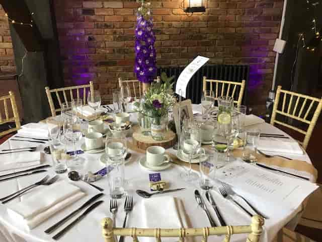 Elegant round table setup in Dickens Inn's Function Suite for weddings and upscale events.