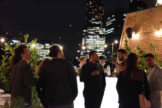 Rooftop event at Uncommon Borough with city lights, ideal for networking and receptions.