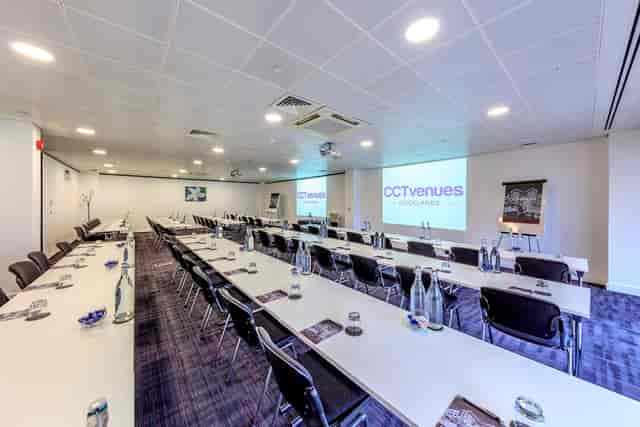 Jasmine Room meeting space with AV setup for corporate workshops and professional training events.