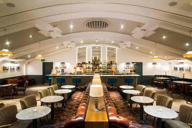 Stylish event space with elegant bar, ideal for cocktail receptions and meetings.