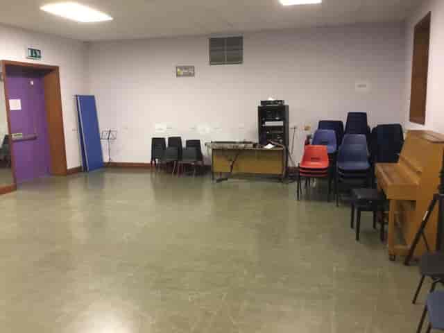 Versatile meeting space with piano for events at The Midi Music Company.