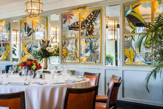 Elegant dining table in The Looking Glass Room, perfect for upscale events and gatherings.