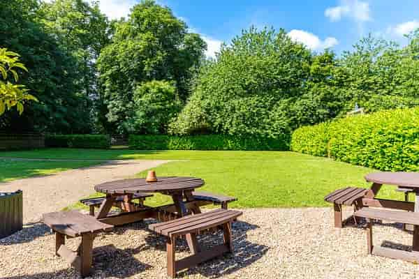 Cobbold Barn at Knebworth House: serene outdoor space for team-building events.