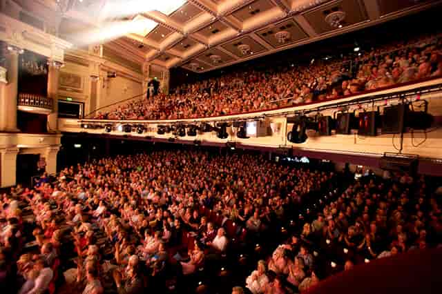 Packed Birmingham Hippodrome auditorium with tiered seating for impactful events.