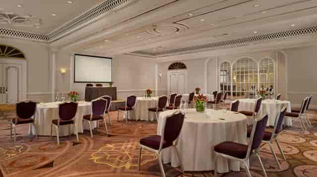Elegant Tudor Rose event space with floral centerpieces for corporate meetings and gatherings.