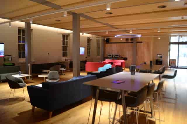 Versatile event space in Dreadnought with modern furniture for networking and presentations.
