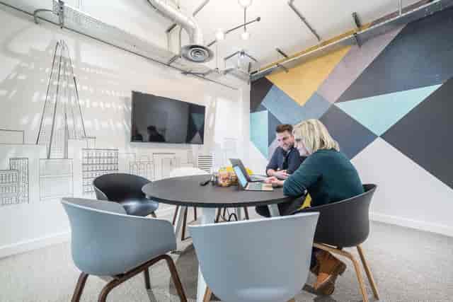 Modern meeting space at The Shard with round table for collaborative brainstorming sessions.