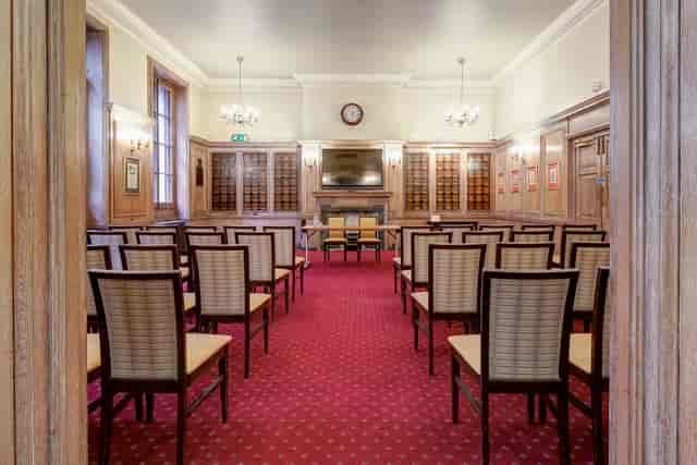 Meeting room at The Holden, featuring wooden paneling for corporate events and workshops.