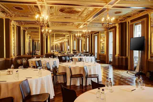 Elegant Pompadour Ballroom with chandeliers, perfect for corporate meetings and galas.