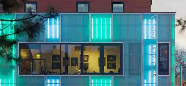 Modern Vortex venue with vibrant neon lighting, perfect for events and gatherings.