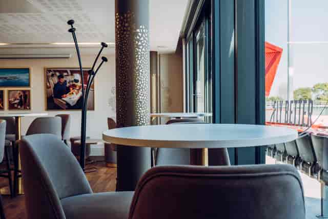 Emirates Lounge at Old Trafford: modern event space with natural light for corporate gatherings.