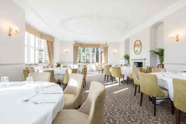 Elegant dining room at New Place Hotel, perfect for corporate meetings and intimate gatherings.