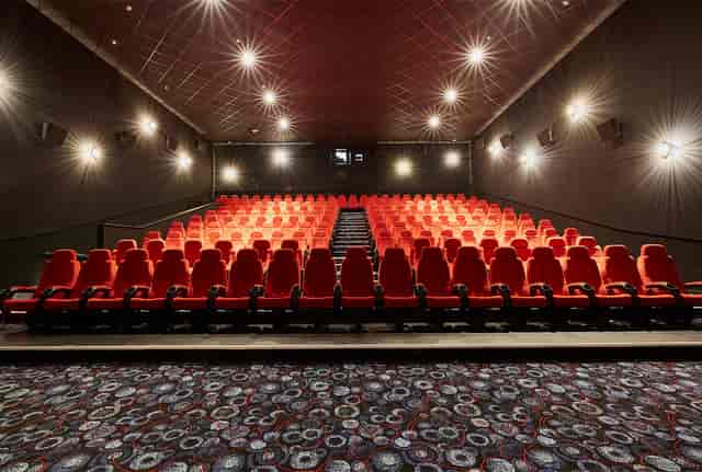 Modern theater with red seating in Cineworld Birmingham for film screenings and corporate events.