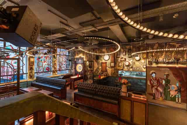 Stylish event venue in Flight Club Manchester with vibrant decor and ambient lighting.