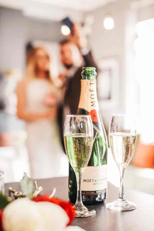 Champagne bottle in Great Guns Social's Main Room during a celebratory event.
