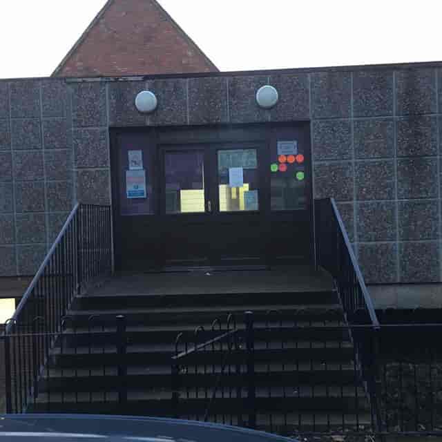 Large hall entrance at St. Mark's Community Centre with stairs, ideal for events and meetings.