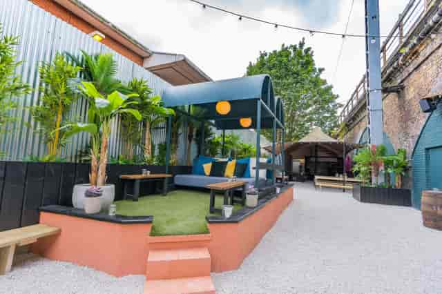 Vibrant outdoor event space with cozy seating for networking and team-building at Night Tales.