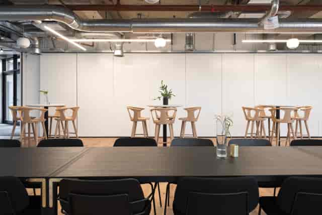 Modern meeting space in Camden House with high-top tables for corporate events.