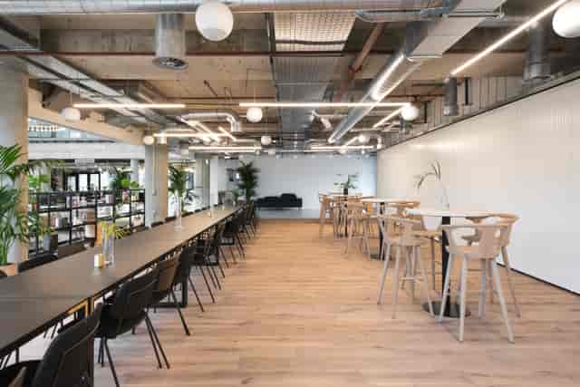 Versatile event space in Camden House with natural lighting, ideal for meetings and gatherings.