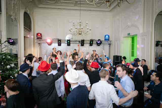 Christmas gala party in Westminster with festive decor and stage lighting for corporate events.