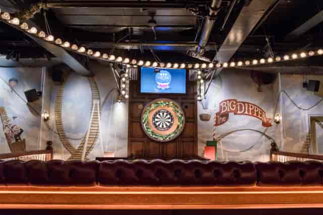 Funfair event space at Flight Club Victoria with dartboard, ideal for team-building and mixers.