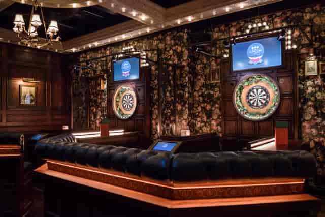 Stylish venue at The Old Vic, featuring dartboards for team-building events.