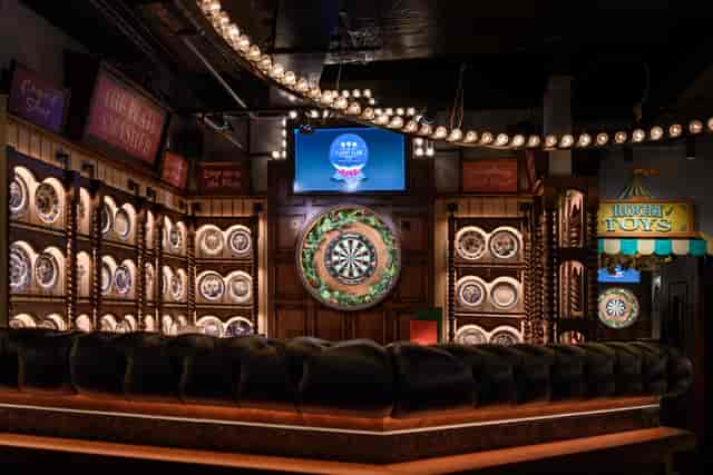 Alt tag: "Interactive event space with dartboard at Flight Club Victoria for team-building activities"