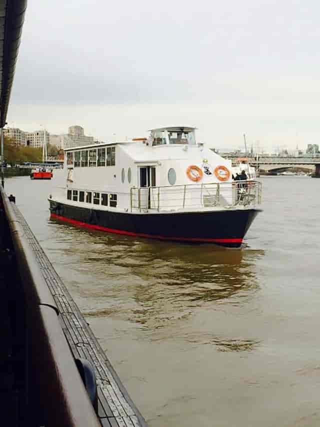 Stylish event boat with panoramic windows for unique corporate gatherings on the river.