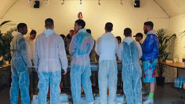 Participants in protective gear at The Sassoon Gallery workshop for team-building events.