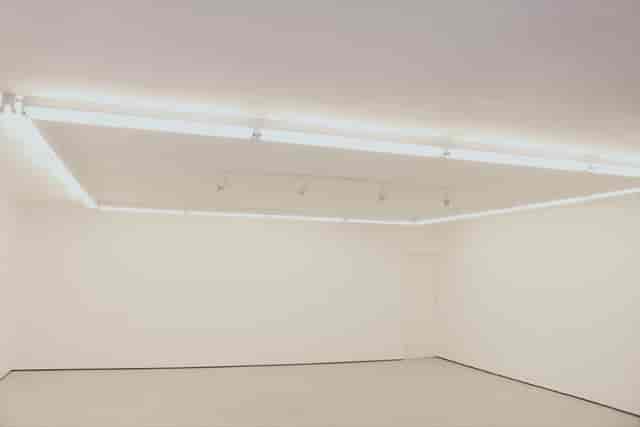 Minimalist Shoreditch gallery space with track lighting for modern pop-up events and exhibitions.