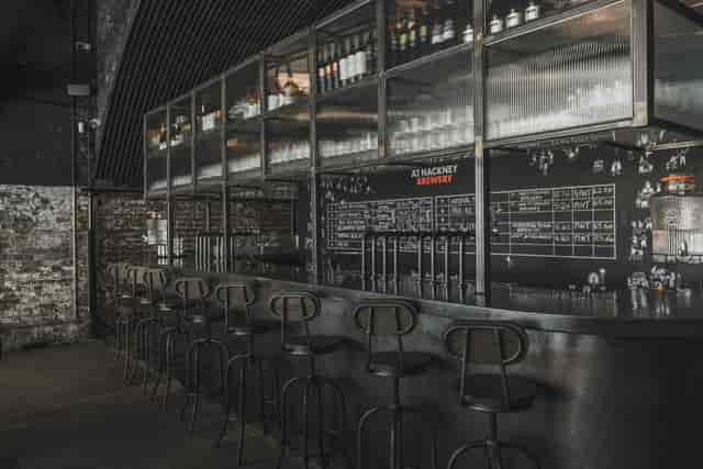 Modern bar area at Hackney Church Brew Co. - ideal for networking events and social gatherings.