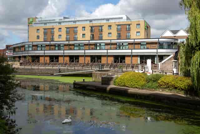 Modern hotel suite with waterfront view, perfect for corporate events and receptions.
