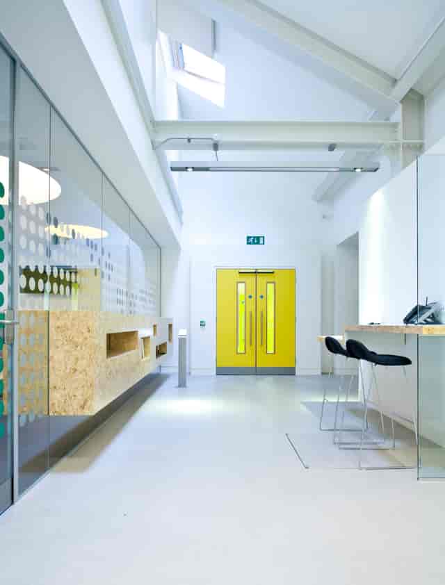 Rehearsal Room at Graeae Theatre with bright yellow door, perfect for networking events.