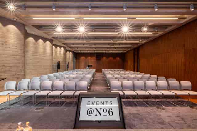Modern event space with sleek chairs, ideal for conferences and presentations.