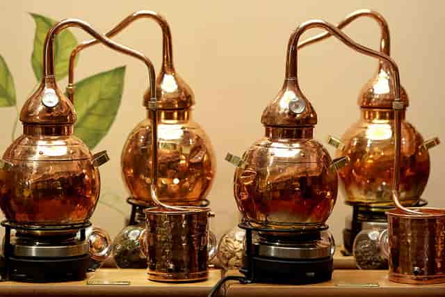 Elegant copper distillation apparatus at Beach Rum Distillery for events and workshops.