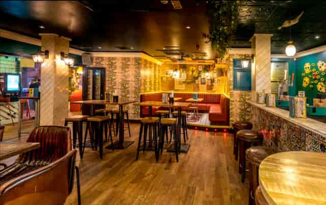 Uptown Barrio Shoreditch venue: high-top seating for networking mixers and social happy hours.