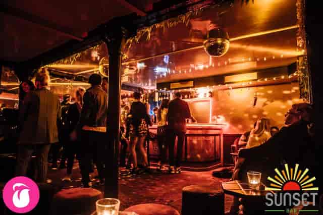 Vibrant event space with disco balls, perfect for cocktail receptions and gatherings.
