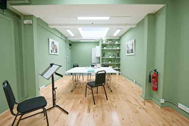 Whitehall Studio at Trafalgar Theatre: versatile meeting space with calming green walls.