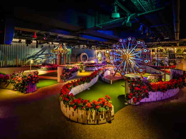 Vibrant East Bandstand Bar with floral decor, perfect for networking events and themed parties.
