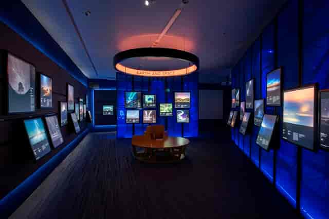 Modern exhibition space with screens, perfect for tech conferences and workshops.
