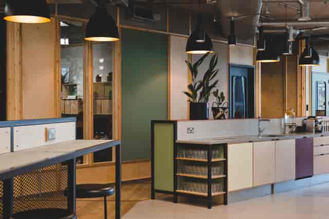 Modern lounge area in FORA - White Collar Factory, perfect for meetings and networking events.