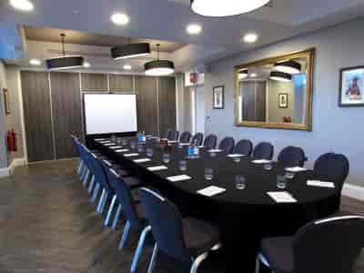 Meeting room at Oddfellows On The Park with modern decor, ideal for professional events.