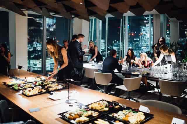 Corporate evening reception at The Shard with floor-to-ceiling city views and catering.