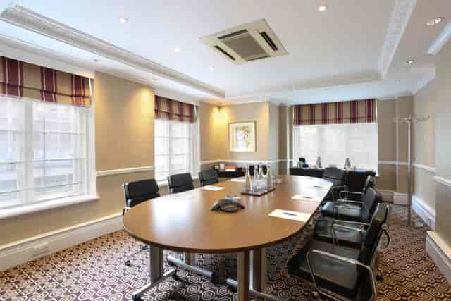 Trafalgar Suite at St Ermin’s Hotel, oval table, ideal for meetings and presentations.