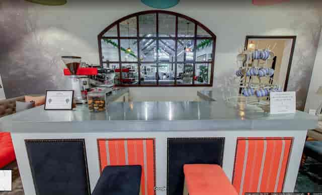 Stylish event space at Sofa.com Harrogate with modern seating and bar for corporate gatherings.