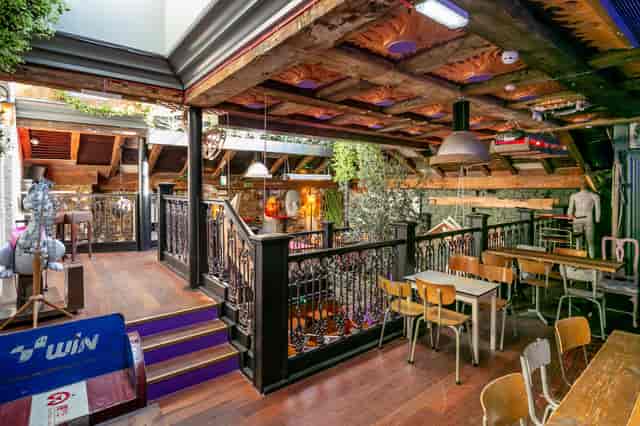 Private Mezzanine at Owl & Hitchhiker: vibrant event space with rustic charm for gatherings.